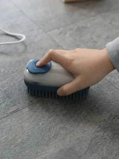 Easy grip liquid filling cleaning brush used on carpet aur tiles saaf karne wala scrubber setup.