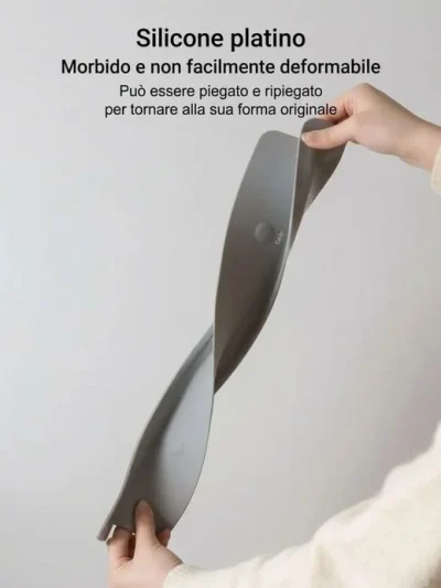 Twisting a heavy-duty sink splash shield to show its flexible silicone material that easily retains shape.