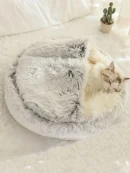 Grey plush indoor cat cave for winter with attached hood and blanket, offering a deep sleep hooded pet bed design.