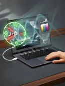 LED USB clock fan with real time display glowing green plugged into laptop on an office table fan USB setup.