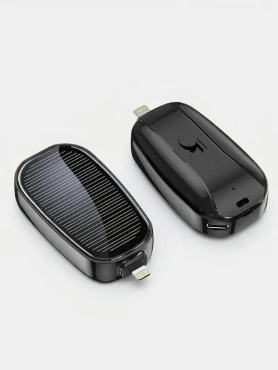 Close-up of a black compact solar mobile charger showing the solar panel and direct plug mini power pod connector.