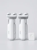 Two white WiFi smart automatic curtain opener motor 2-pack units displayed with a Bluetooth remote control for easy operation.